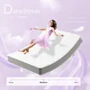 A woman in a pink dress is floating on a mattress against a purple, cloudy background. Voir les images du produit