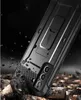 A rugged phone case is shown in a dramatic, dark setting with debris falling around it, suggesting durability and protection. Náhled obrázku produktu