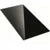 A black rectangular glass plate, likely a fireplace hearth plate, is shown at an angle on a white background. Náhled obrázku produktu
