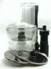 A food processor bowl, lid, and attachments are displayed against a white background. Voir les images du produit