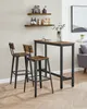 A pair of industrial-style bar stools with a high table in a home setting. Náhled obrázku produktu