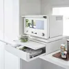 A white kitchen shelf with a white microwave on top and a pull-out drawer underneath. Podgląd zdjęcia produktu