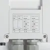 A close-up of a white electronic device with a label showing settings for power, detection, hold time, and daylight sensor. Náhľad obrázku produktu