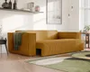 A modern living room with a mustard yellow corduroy sofa, a rug, and a shelf with decor. Náhled obrázku produktu