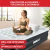 A woman meditating on an air mattress in a bright room. Produktbild-Vorschau