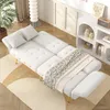 A white sofa bed is shown in a well-lit room with a plant and a shelf unit. Náhled obrázku produktu