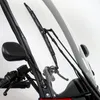 A close-up view of the windshield and windshield wipers of a vehicle, likely a three-wheeled vehicle or scooter, with a mirror visible on the left. Produktbild-Vorschau