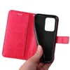 A hand holding a red floral flip phone case. Produktbild-Vorschau