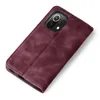 A burgundy flip case for a smartphone is shown from a diagonal top-down view against a white background. Produktbild-Vorschau