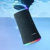 A black Soundcore Flare II Bluetooth speaker is partially submerged in blue water, with colorful lights illuminating the top and bottom edges. Produktbild-Vorschau