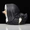 A side profile of a novelty rubber duck toy dressed as a nun, against a black background. Podgląd zdjęcia produktu