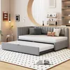 A gray daybed with a pull-out trundle bed is shown in a room with a patterned rug. Anteprima dell’immagine prodotto