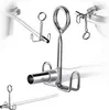 Close-up studio shot of stainless steel juicer accessories, including a hose and clips, against a white background. Produktbild-Vorschau