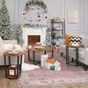 A living room decorated for Christmas, featuring a Christmas tree, fireplace, and furniture. Podgląd zdjęcia produktu