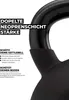 A close-up of a black kettlebell with text overlays describing its features. Produktbild-Vorschau