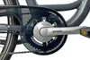A close-up view of a bicycle's crankset and chain guard. Produktbild-Vorschau
