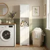 A laundry room with a washing machine, a tall cabinet, and a laundry basket. Voir les images du produit