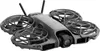 A gray drone with four propellers and a camera is shown against a white background. Produktbild-Vorschau