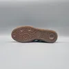 The image shows the sole of an Adidas Handball Spezial shoe against a plain gray background. Voir les images du produit