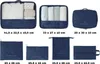 A collection of seven blue fabric organizer bags for luggage, displayed on a white background with dimensions listed below each bag. Anteprima dell’immagine prodotto