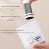 A hand holding a filter assembly above a transparent dustbin, with labels pointing to different parts. Produktbild-Vorschau