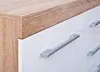 A close-up view of a dresser or cabinet with a wood-grain top and white drawers with silver handles. Produktbild-Vorschau