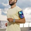 A man is running outdoors with a smartphone armband and a smartwatch. Náhled obrázku produktu