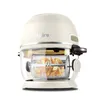 A white air fryer with a glass bowl and a rotating basket filled with food. Voir les images du produit