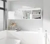 A modern bathroom with a wall-mounted cabinet and a bathtub. Produktbild-Vorschau