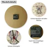 A collage of images showing details of a wall clock with a koala motif, including the back of the clock, a close-up of the koala face, and the clock mechanism. Produktbild-Vorschau