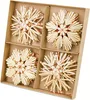 A set of four straw star ornaments in a cardboard box. Produktbild-Vorschau