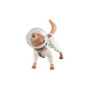 A toy dog wearing a space suit and helmet. Produktbild-Vorschau