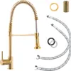 A gold kitchen faucet with a coiled hose and accessories laid out on a white background. Náhled obrázku produktu