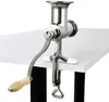 A manual meat grinder clamped to a white table. Produktbild-Vorschau
