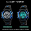 Two SKMEI digital watches are shown side-by-side against a black background, demonstrating their normal and backlight display modes. Náhled obrázku produktu