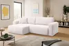 A modern living room with a white sectional sofa, coffee table, and artwork. Voir les images du produit