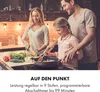 A family cooking together in a kitchen. Produktbild-Vorschau