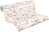 A roll of wallpaper with a brick pattern. Produktbild-Vorschau