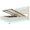 A white upholstered bed frame with the mattress support mechanism open, revealing storage space underneath. The bed has integrated LED lighting along the base and headboard. Anteprima dell’immagine prodotto