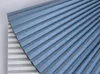 A close-up view of a pleated fabric, likely a blind or curtain, in blue and gray tones. Produktbild-Vorschau