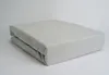 A folded fitted sheet on a white background. Produktbild-Vorschau