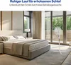 A bedroom with a bed and a fan. Podgląd zdjęcia produktu