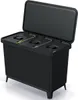A black multi-compartment trash bin with its lid open, showing three separate compartments inside. The bin is elevated on four short legs. Náhľad obrázku produktu