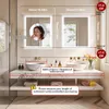 A bathroom vanity with two illuminated mirrors, sinks, and faucets. Náhľad obrázku produktu