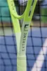 A close-up shot of a tennis racket with the brand name visible. Produktbild-Vorschau