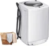 A white compact washing machine with a basket of laundry beside it. Produktbild-Vorschau