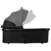 A black baby bassinet with an adjustable canopy shown in profile against a white background. Produktbild-Vorschau