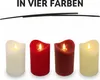 Four LED candles of different colors are displayed in a row against a white background. Produktbild-Vorschau