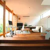 A modern living room with a workstation, sofa, and stairs. Anteprima dell’immagine prodotto