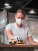 A woman is sanding a piece of wood with a power tool. Náhľad obrázku produktu
